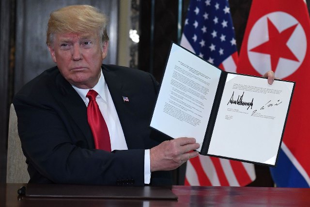 Nhìn lại những khoảnh khắc 'đắt giá' của Hội nghị Thượng đỉnh Mỹ-Triều ảnh 11
